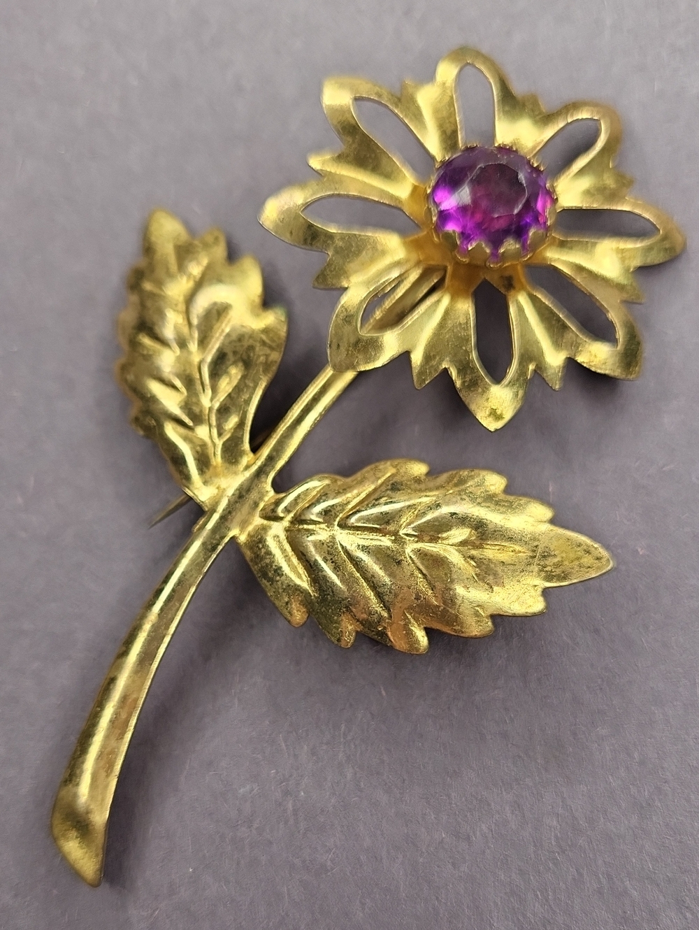 Gold Floral Brooch with Purple Center Stone